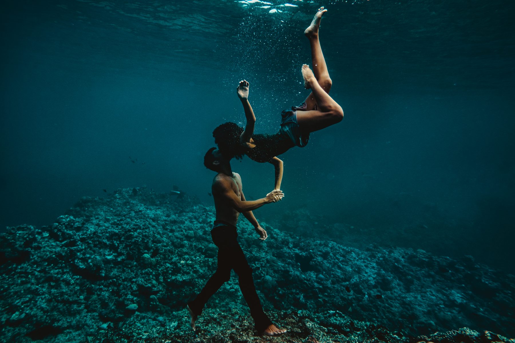 Couple swimming underwater