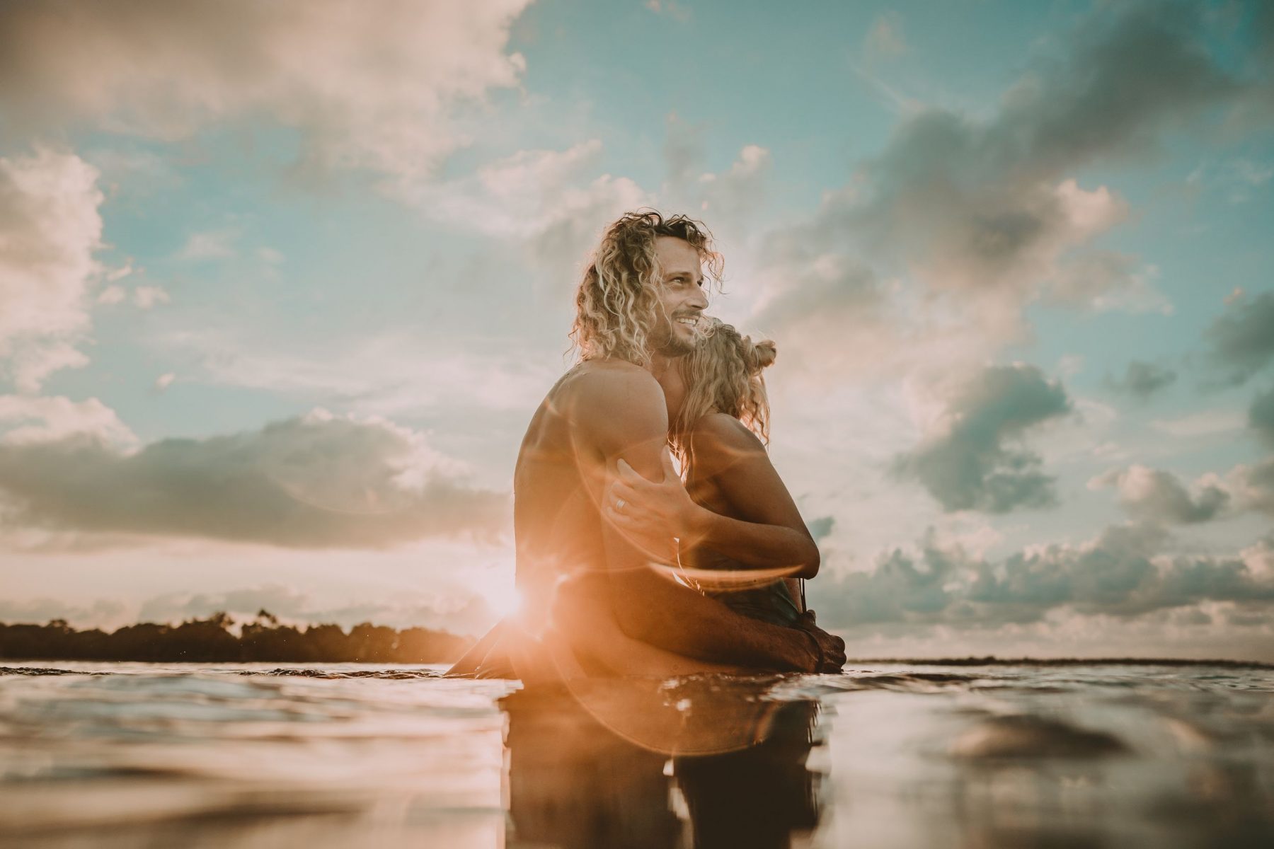 Couple during sunset in the water