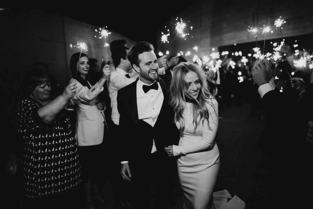 Wedding couple with a sparkler exit