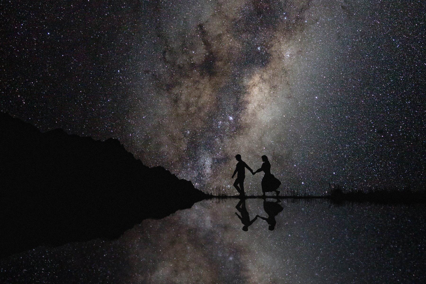 Wedding couple with the milkyway stars in the background.